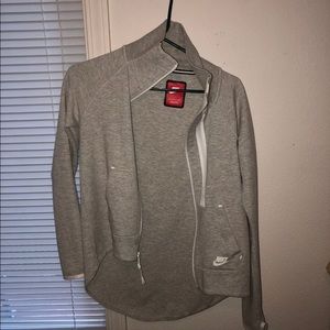 Grey Nike cape jacket.